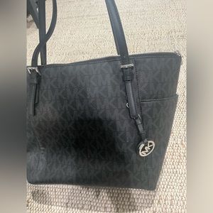 Michael Kors black tote bag.